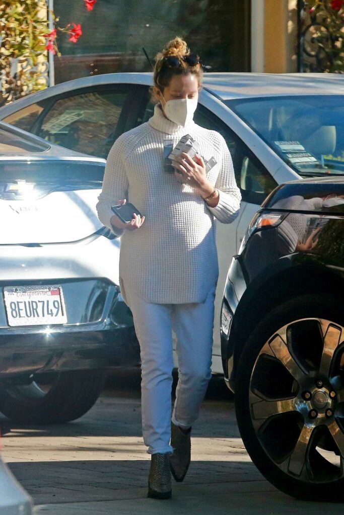 Ashley Tisdale in a White Knit Turtleneck