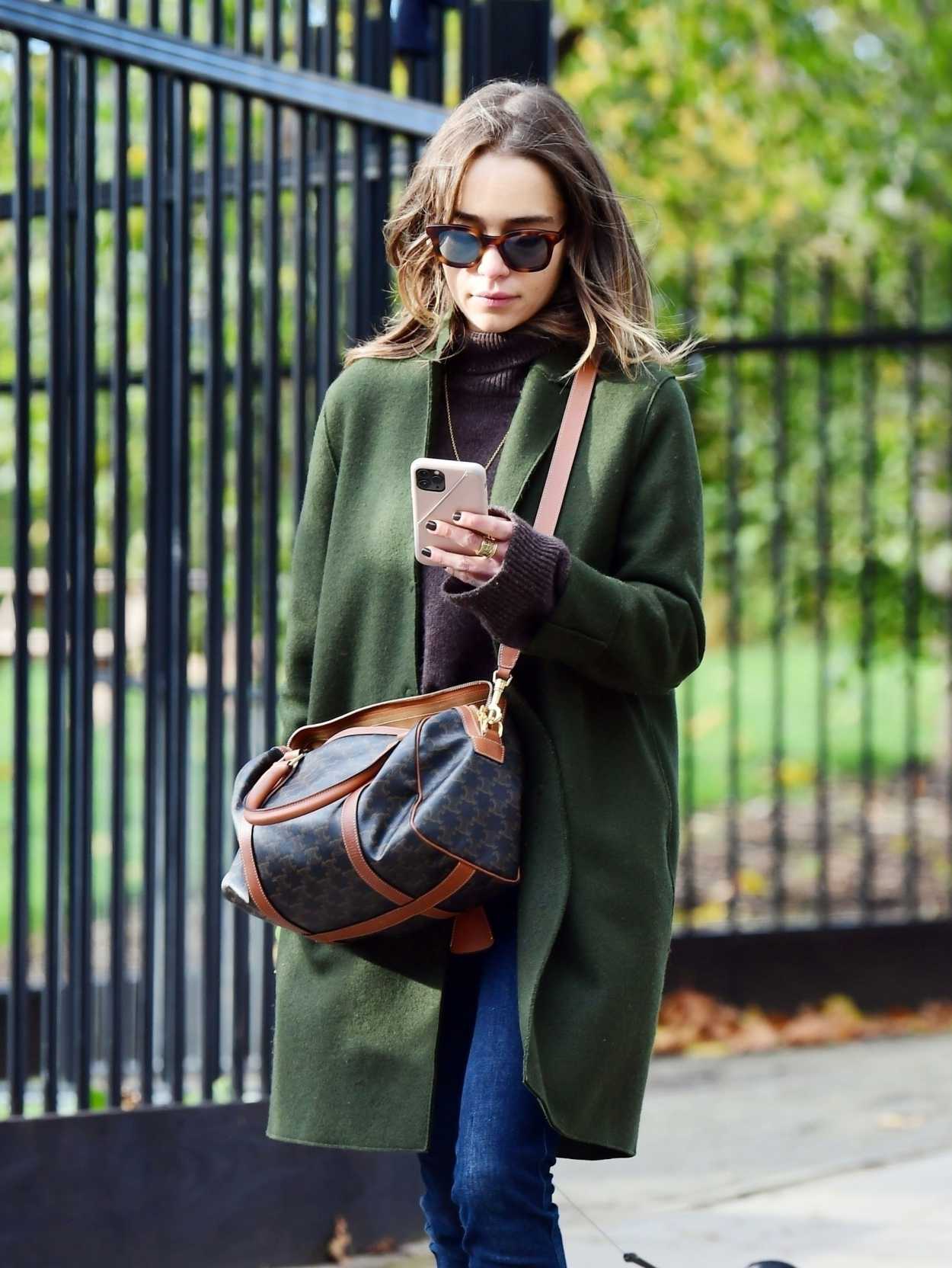 Emilia Clarke in a Green Coat Walks Her Dog in London 11/01/2020 ...