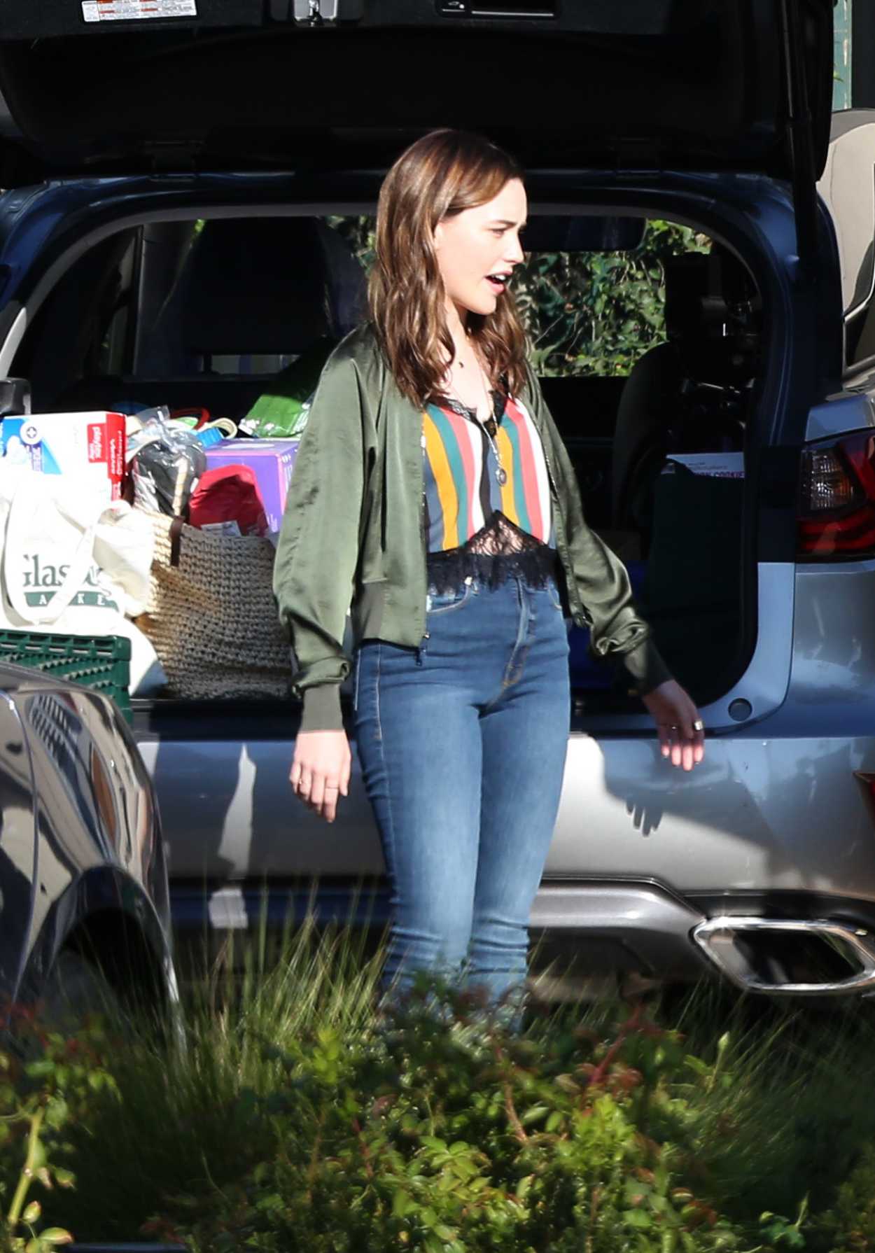 Victoria Pedretti in an Olive Jacket on the Set of the Third Season of