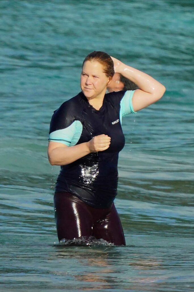 Amy Schumer In A Black Swimsuit Enjoys A Day On The Beach In St Barths