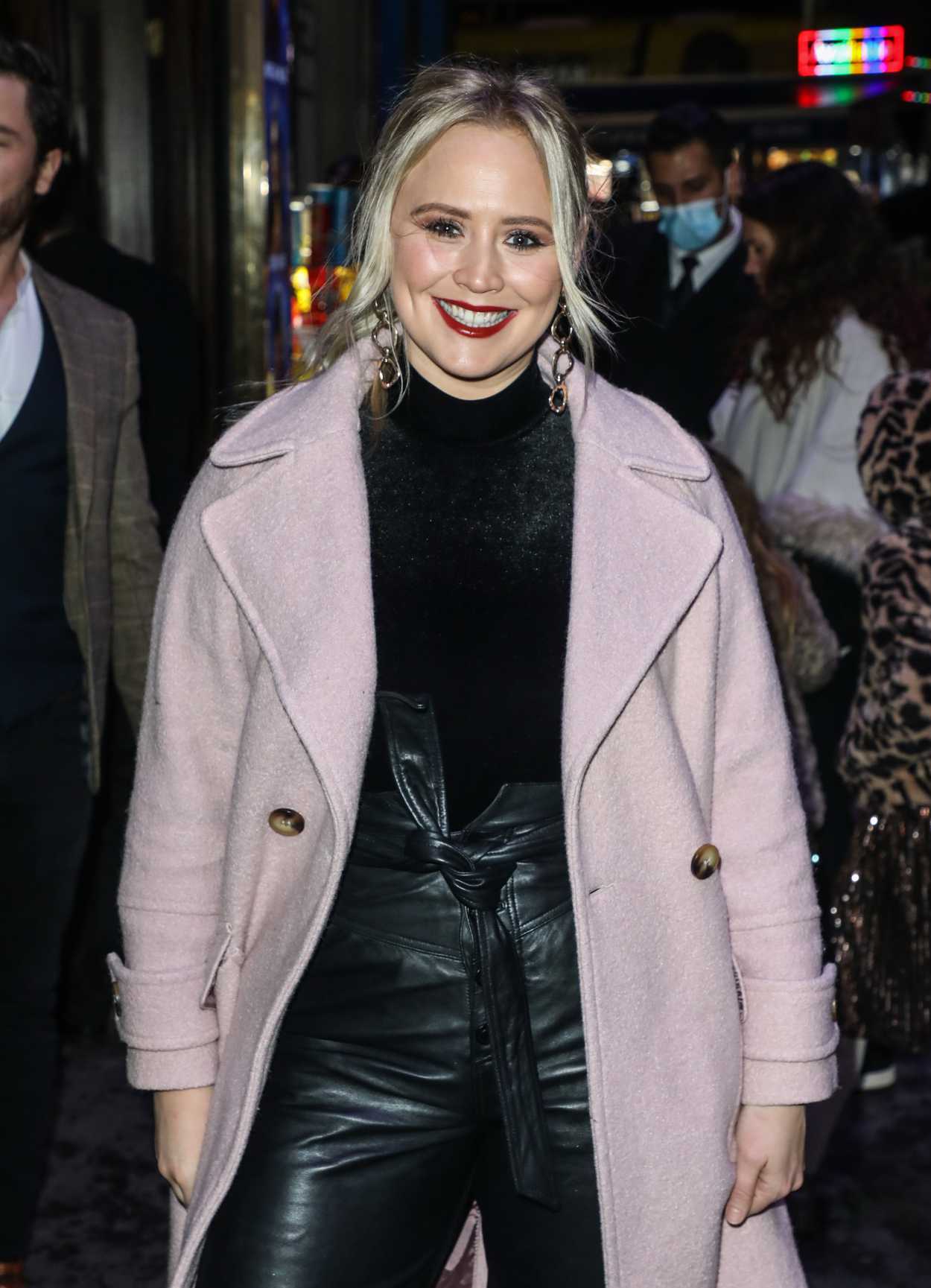 Amy Walsh in a Pink Coat Arrives at the Press Night for A Christmas