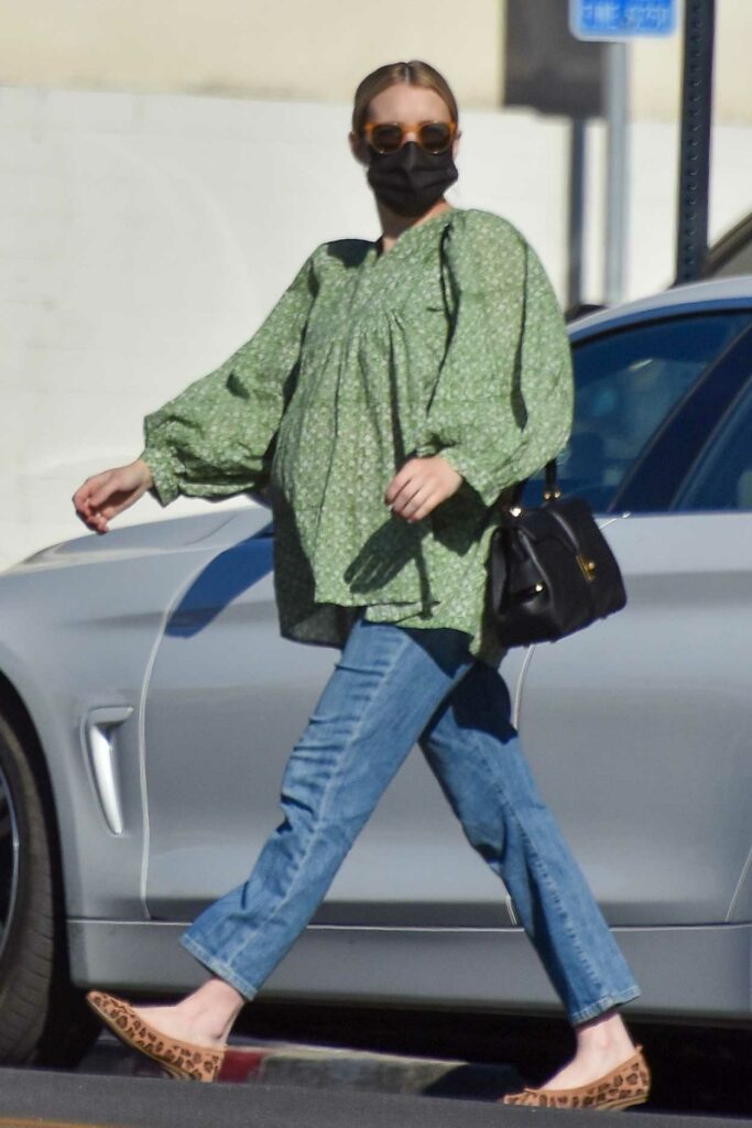 Emma Roberts in a Green Blouse