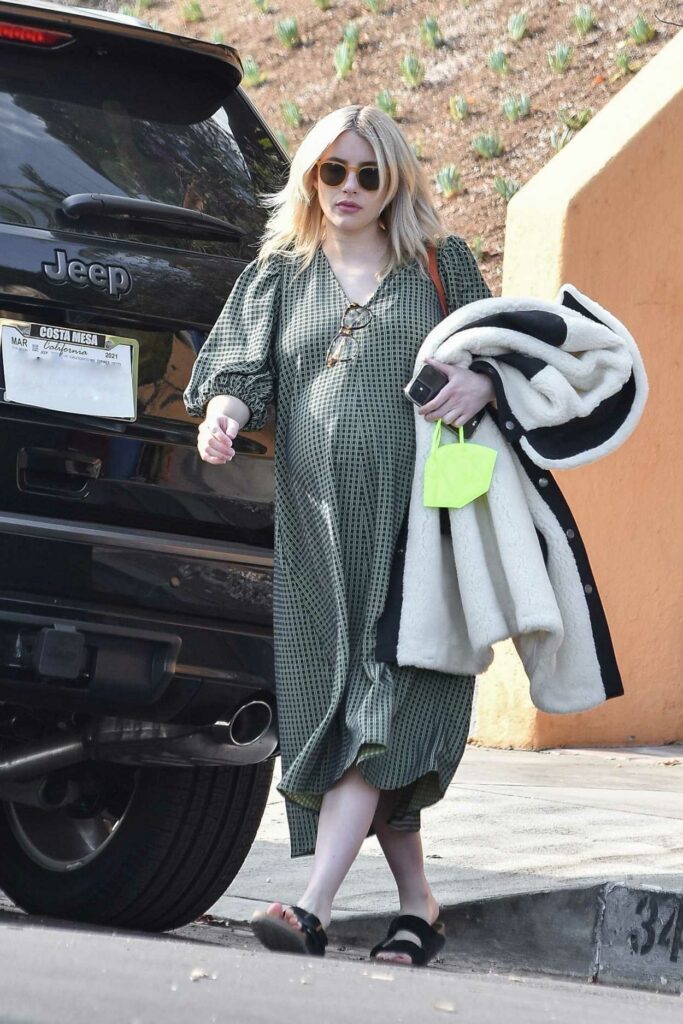 Emma Roberts in an Olive Dress
