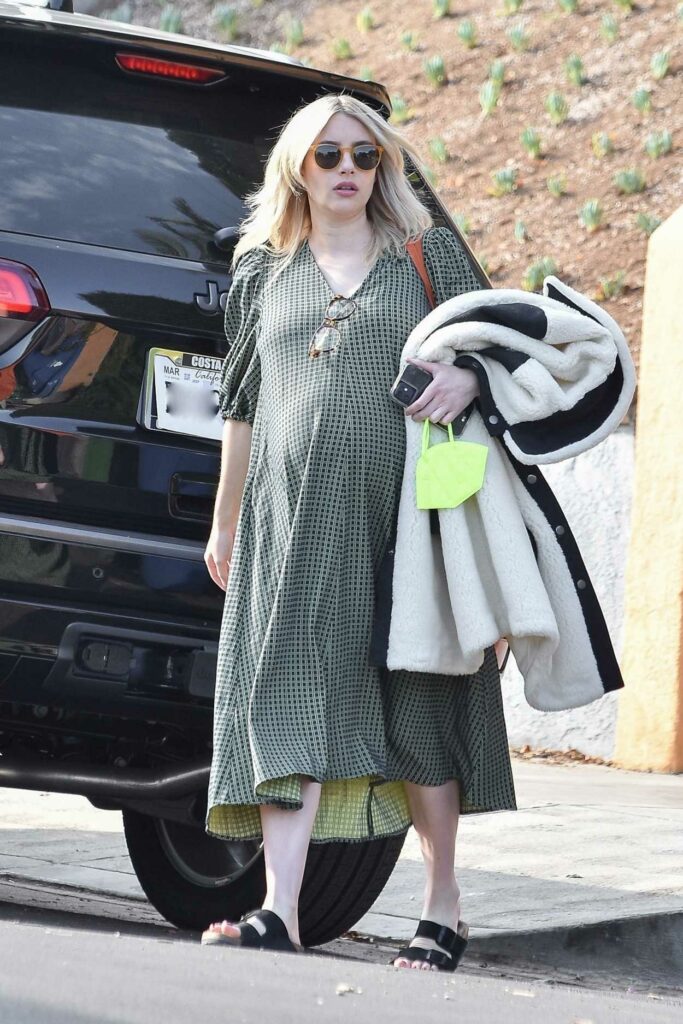 Emma Roberts in an Olive Dress
