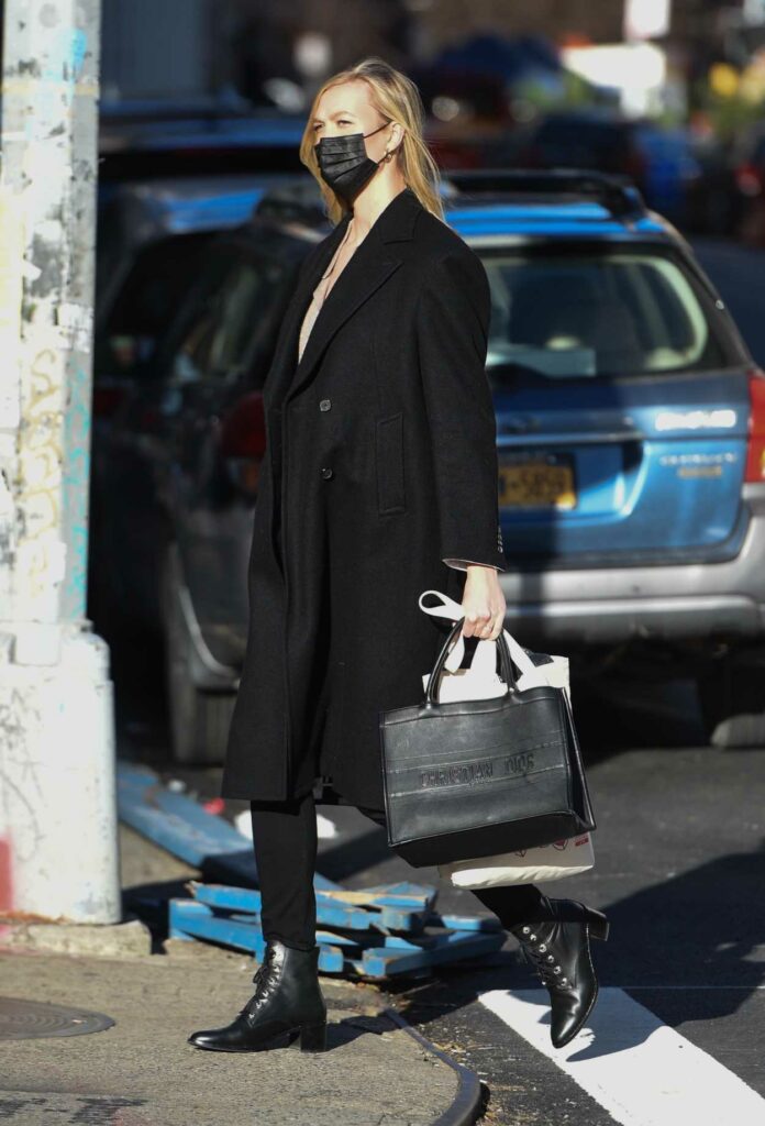 Karlie Kloss in a Black Coat