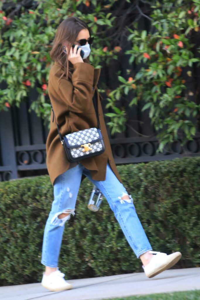 Lily Collins in a Blue Ripped Jeans