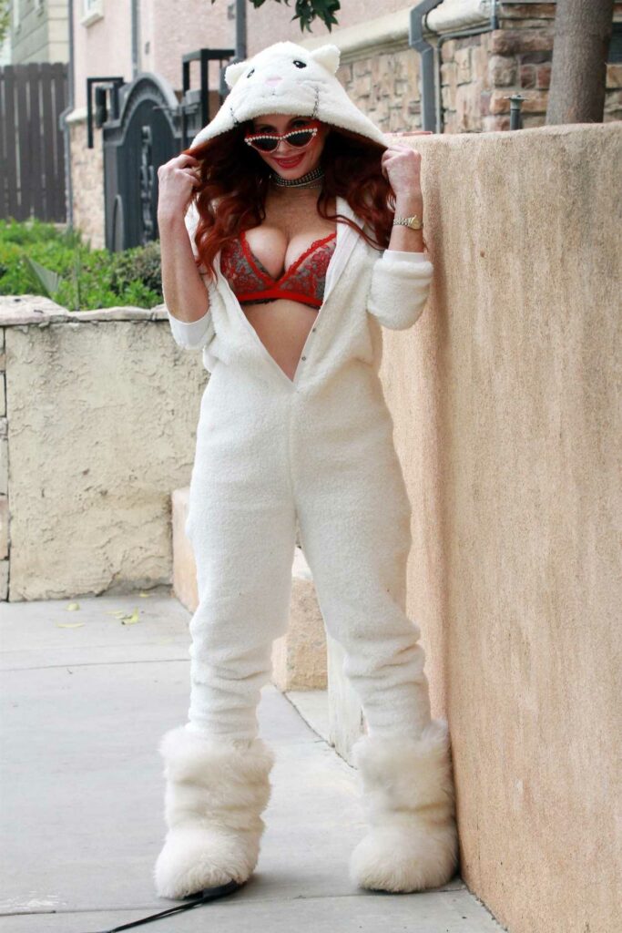 Phoebe Price in a White Cat Jumpsuit