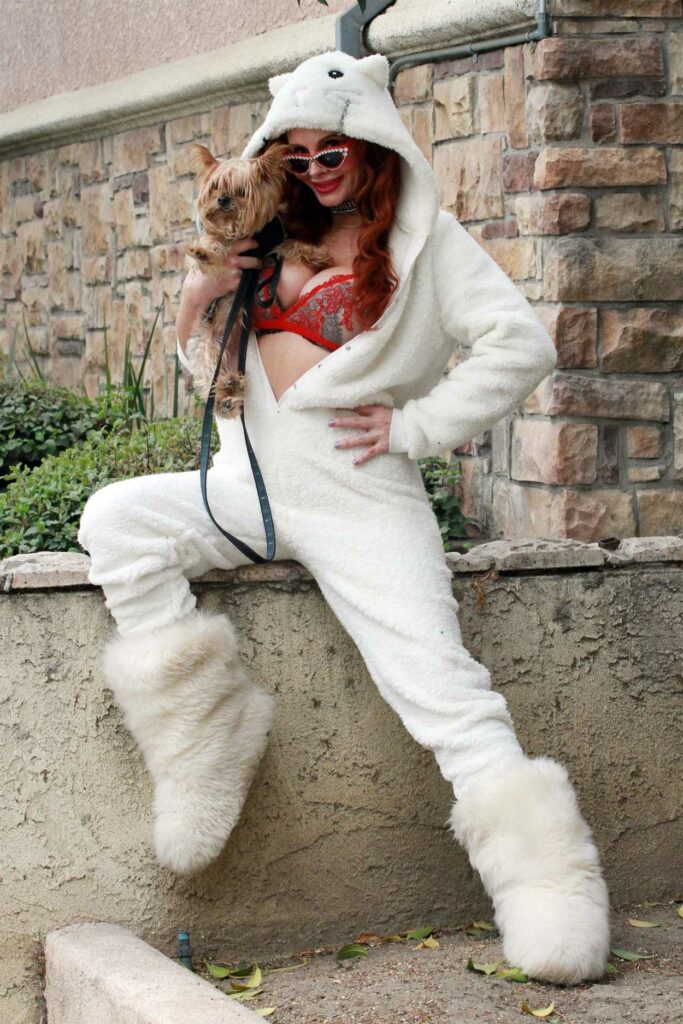 Phoebe Price in a White Cat Jumpsuit