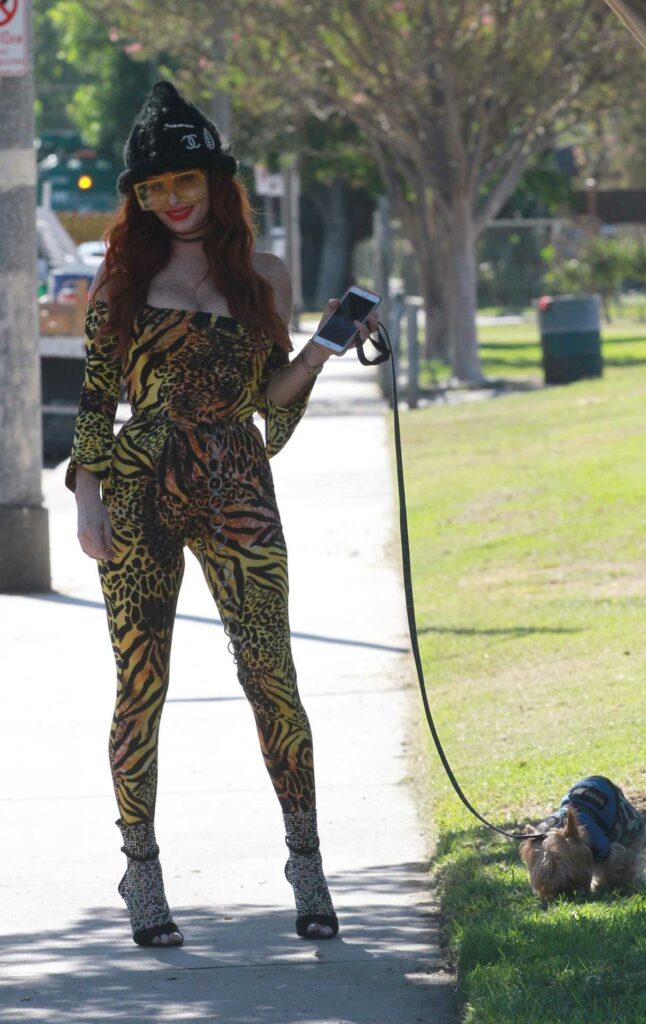 Phoebe Price in an Animal Print Catsuit