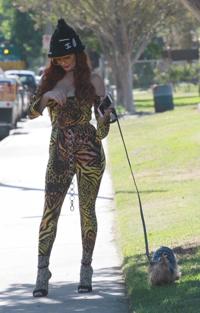 Phoebe Price in an Animal Print Catsuit