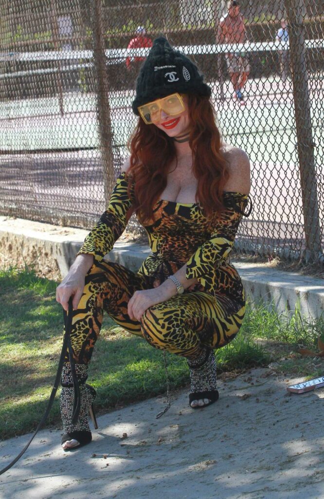 Phoebe Price in an Animal Print Catsuit