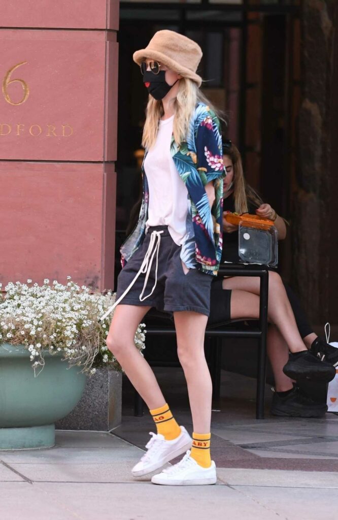 Cara Delevingne in a White Sneakers