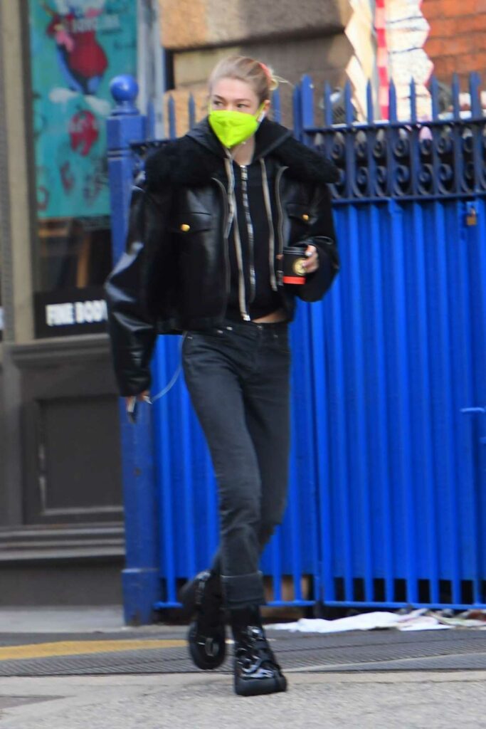 Hunter Schafer in a Neon Green Protective Mask