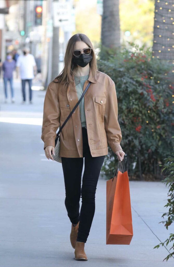 Lily Collins in a Tan Leather Jacket