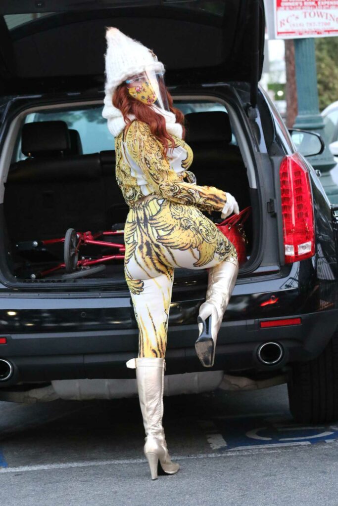 Phoebe Price in a Yellow Protective Mask