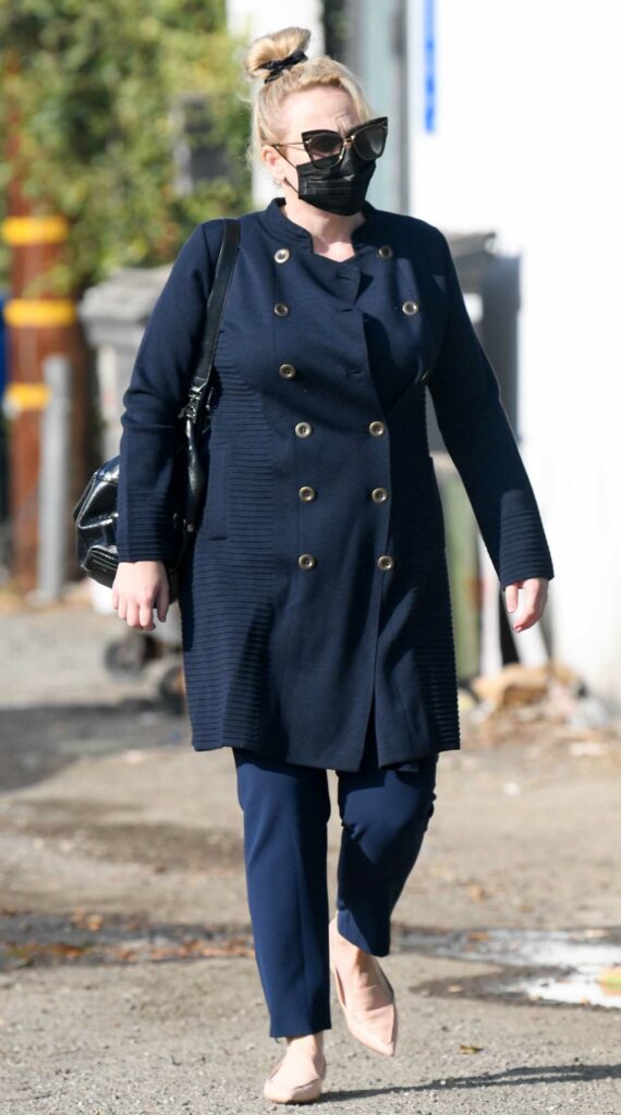 Rebel Wilson in a Black Protective Mask