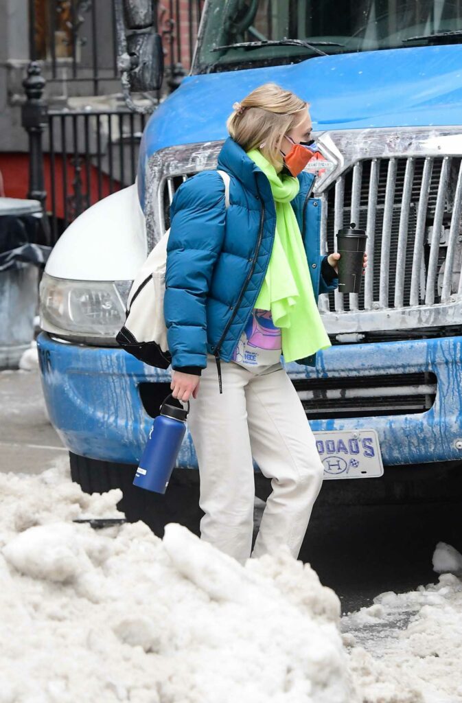 AnnaSophia Robb in a Blue Puffer Jacket