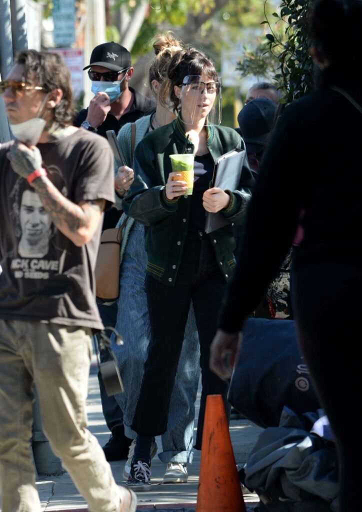 Dakota Johnson in a Green Jacket