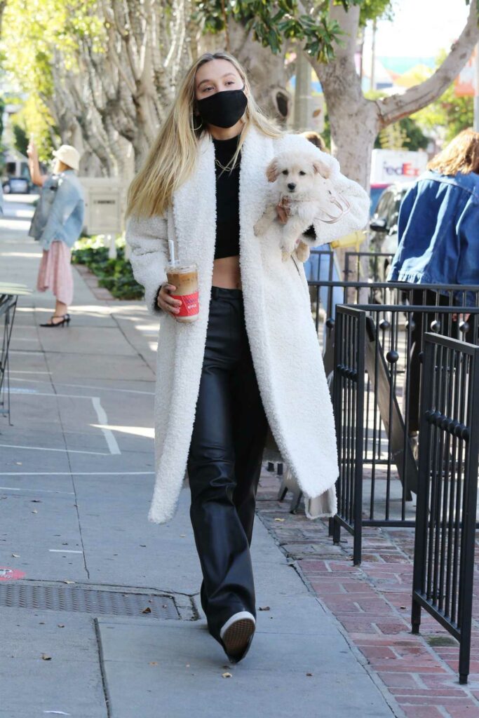 Alexis Ren in a Black Pants