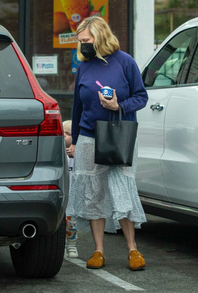 Kristen Dunst in a Blue Sweatshirt