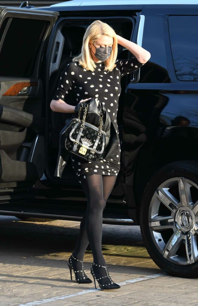 Paris Hilton in a Black Floral Mini Dress