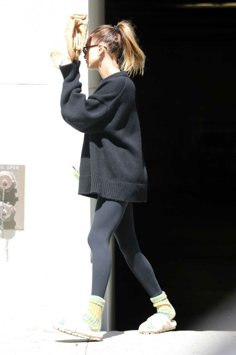 Hailey Bieber in a Black Oversized Sweater Leaves Her Stylist’s Office