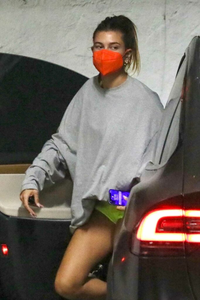 Hailey Bieber in a Red Protective Mask
