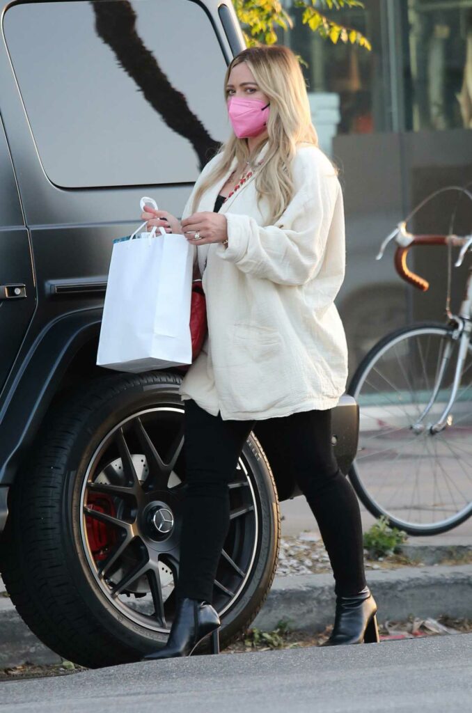 Hilary Duff in a Pink Protective Mask