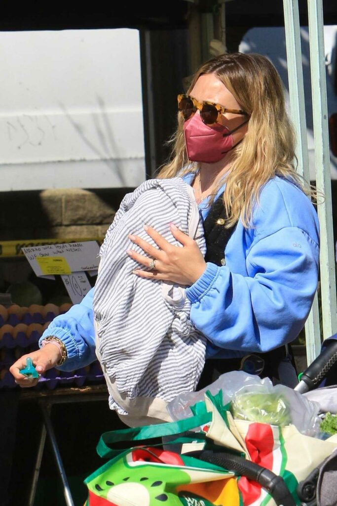 Hilary Duff in a Red Protective Mask