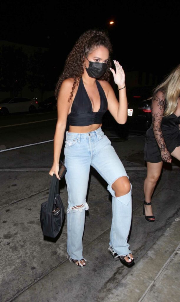 Madison Pettis in a Blue Ripped Jeans