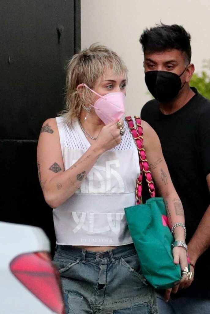 Miley Cyrus in a Pink Protective Mask