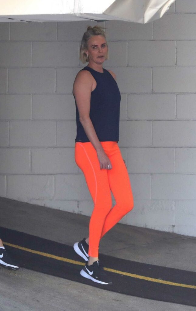 Charlize Theron in an Orange Leggings
