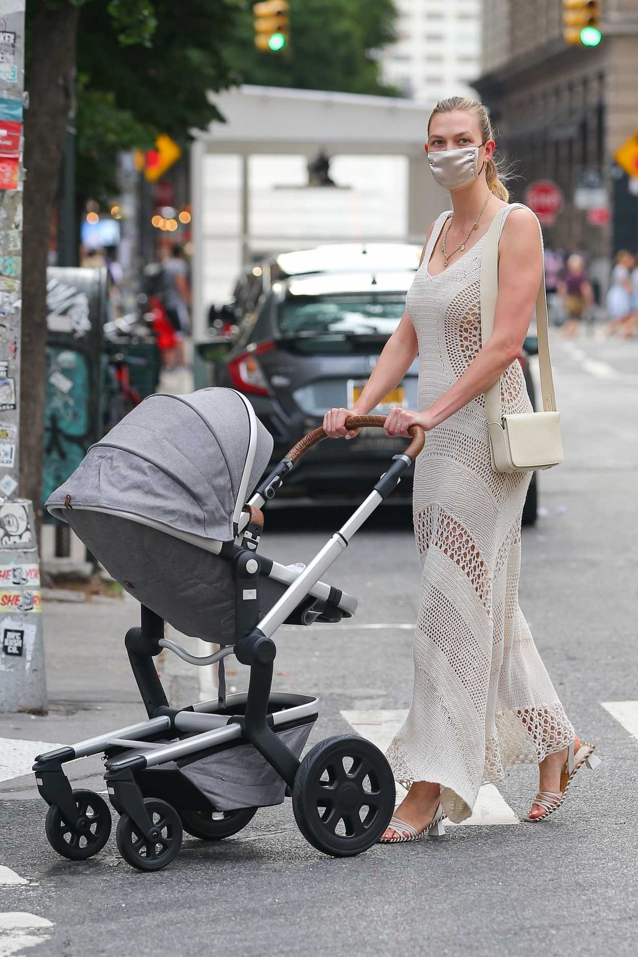 Karlie Kloss in a Beige Dress Takes Her Baby for a Stroll in New York