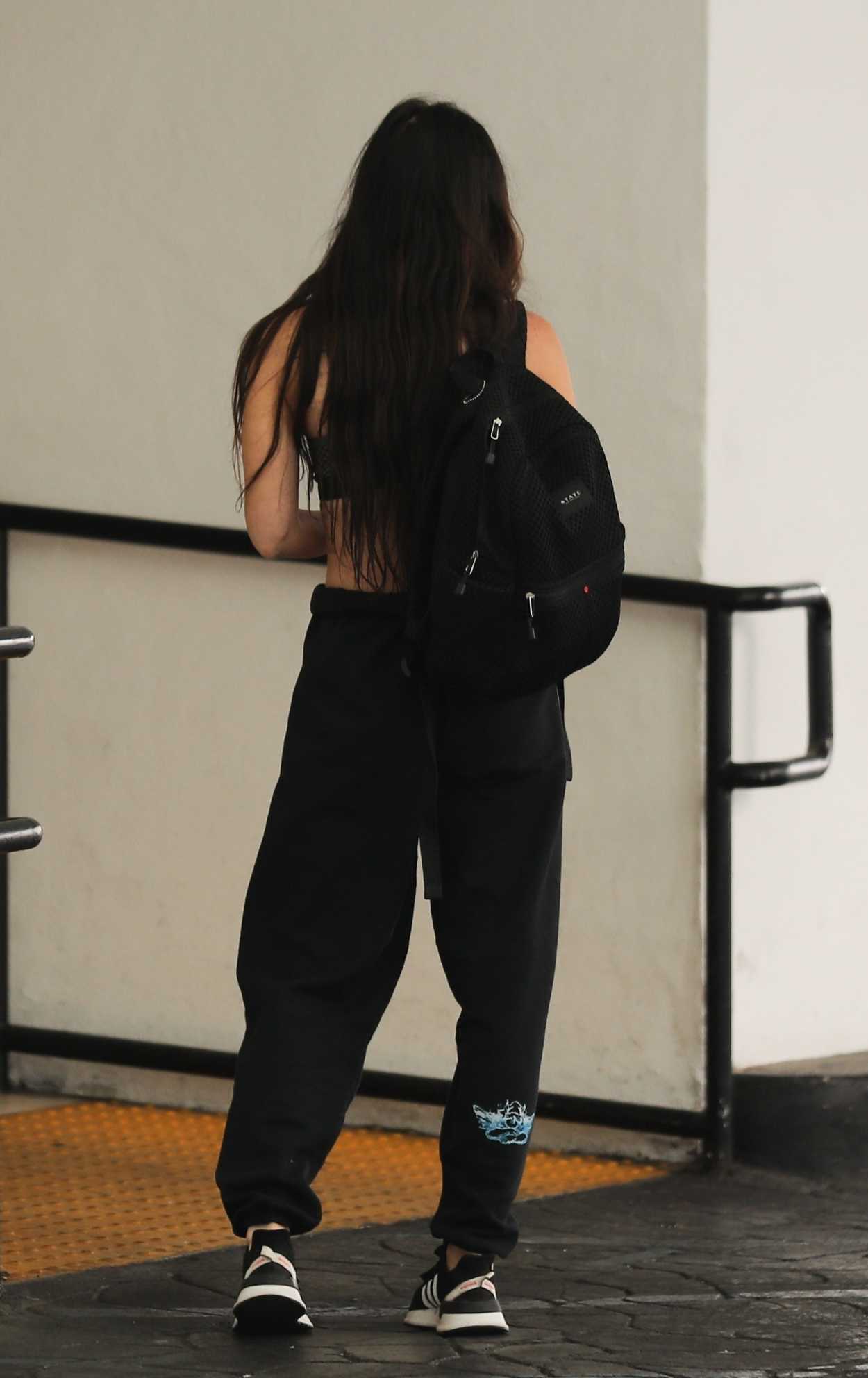 Megan Fox in a Black Sweatpants Waits for Car at the Valet in Beverly ...