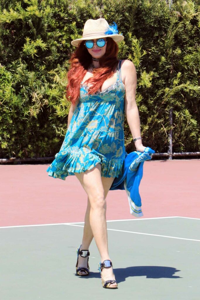 Phoebe Price in a Blue Floral Mini Dress