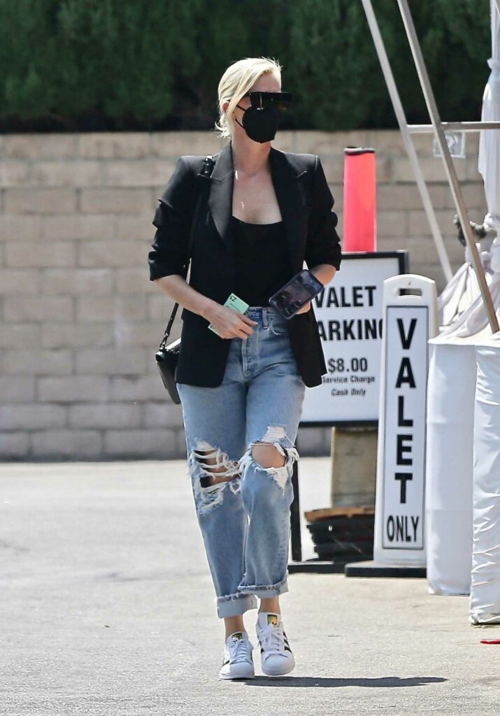 Charlize Theron in a Blue Ripped Jeans