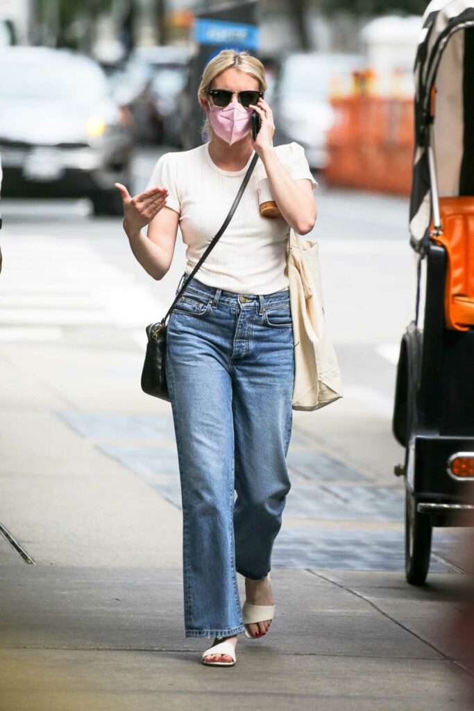 Emma Roberts in a Pink Protective Mask