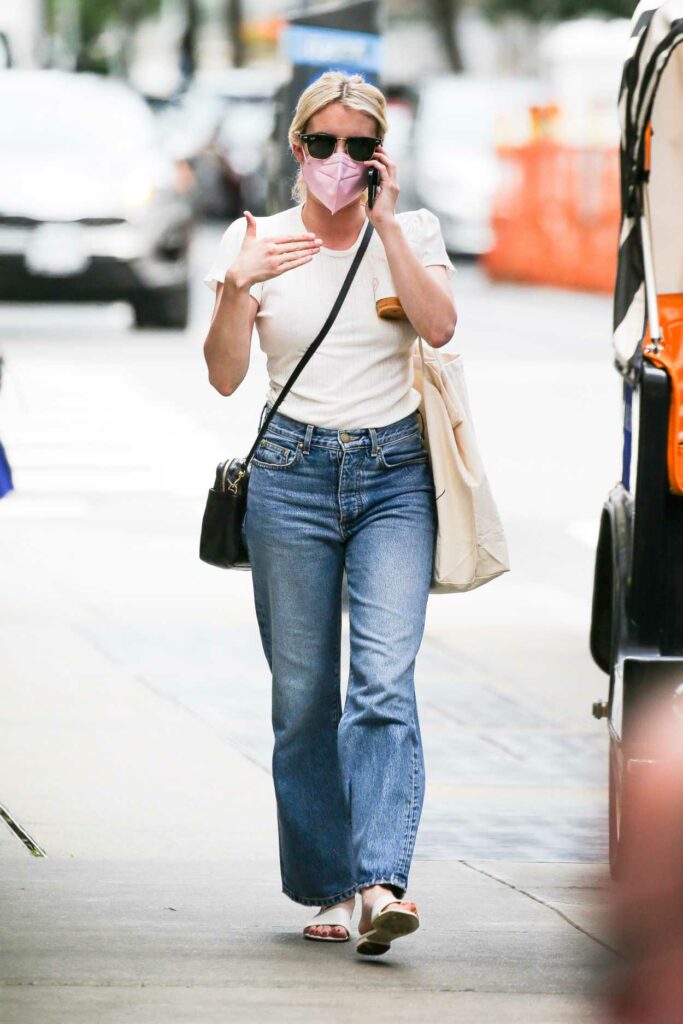 Emma Roberts in a Pink Protective Mask