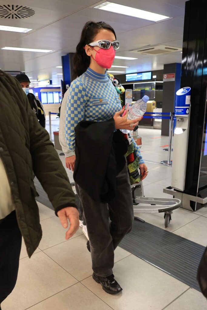 Dua Lipa in a Pink Protective Mask Arrives at Malpensa Airport in Milan 09/27/2021