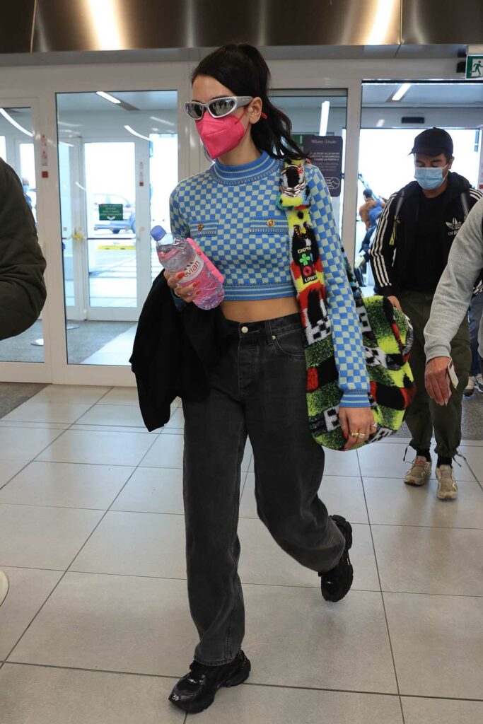 Dua Lipa in a Pink Protective Mask Arrives at Malpensa Airport in Milan 09/27/2021