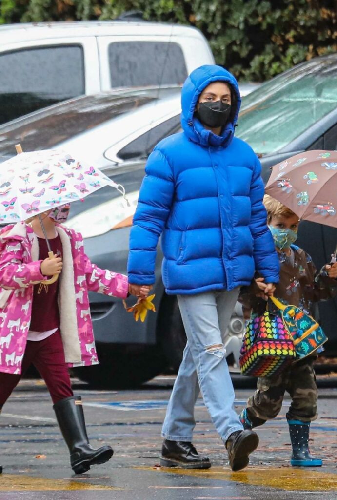 Mila Kunis in a Blue Puffer Jacket