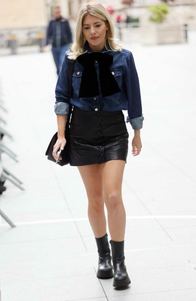 Mollie King in a Black Leather Mini Skirt