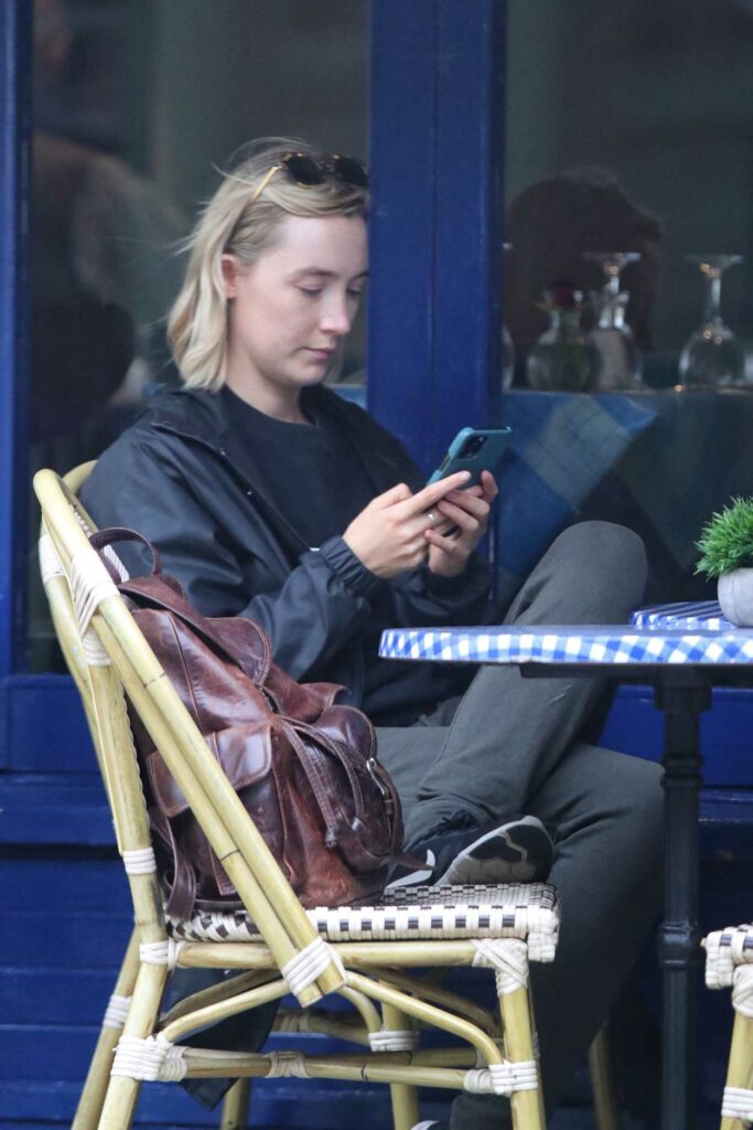 Saoirse Ronan in a Black Trench Coat