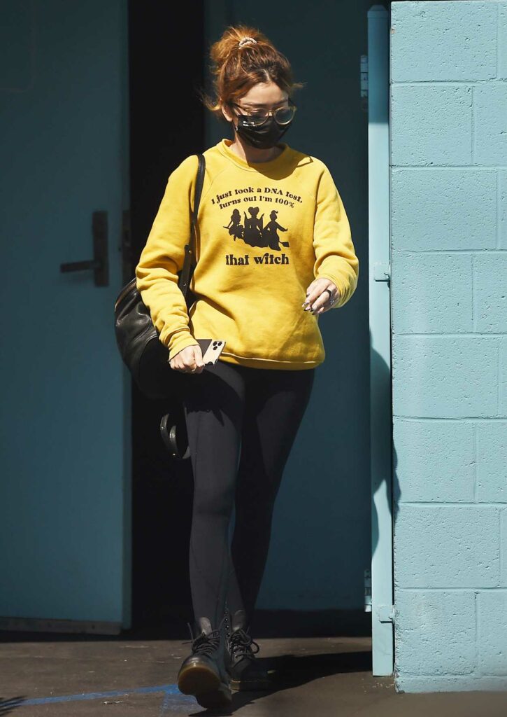 Sarah Hyland in a Yellow Sweatshirt
