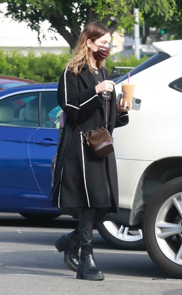 Ashley Benson in a Black Coat