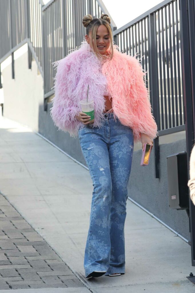 Chrissy Teigen in a Pink Feathered Sweater