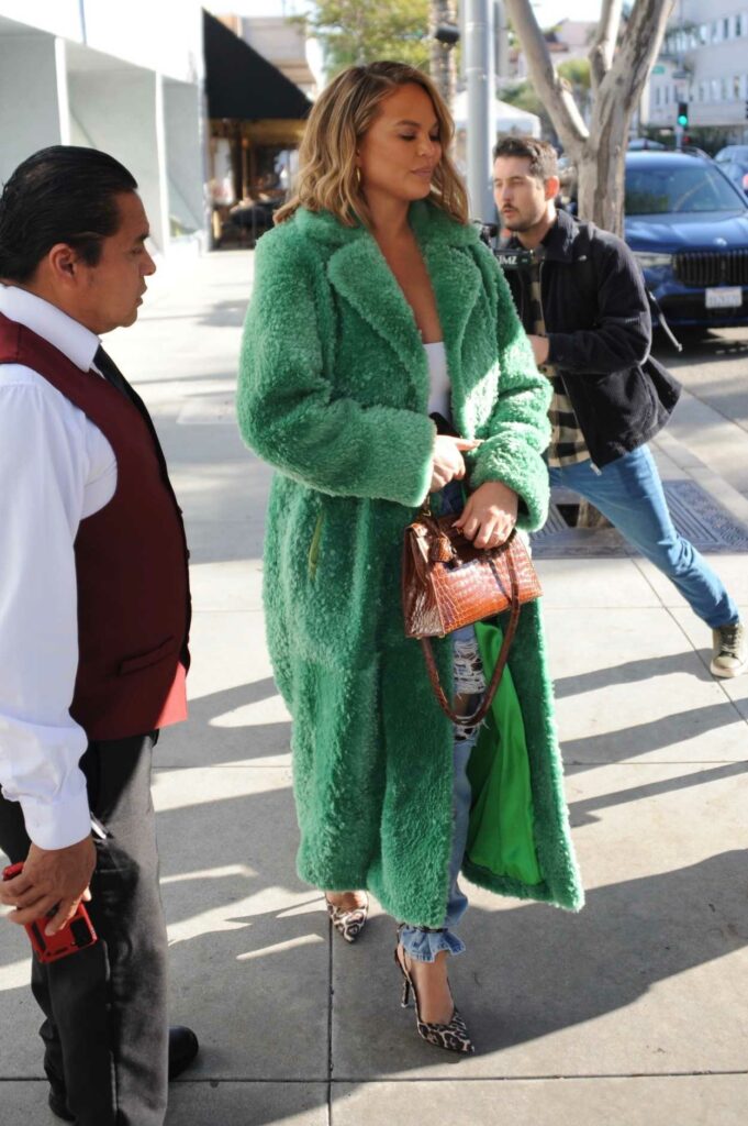 Chrissy Teigen in a Green Faux Fur Coat