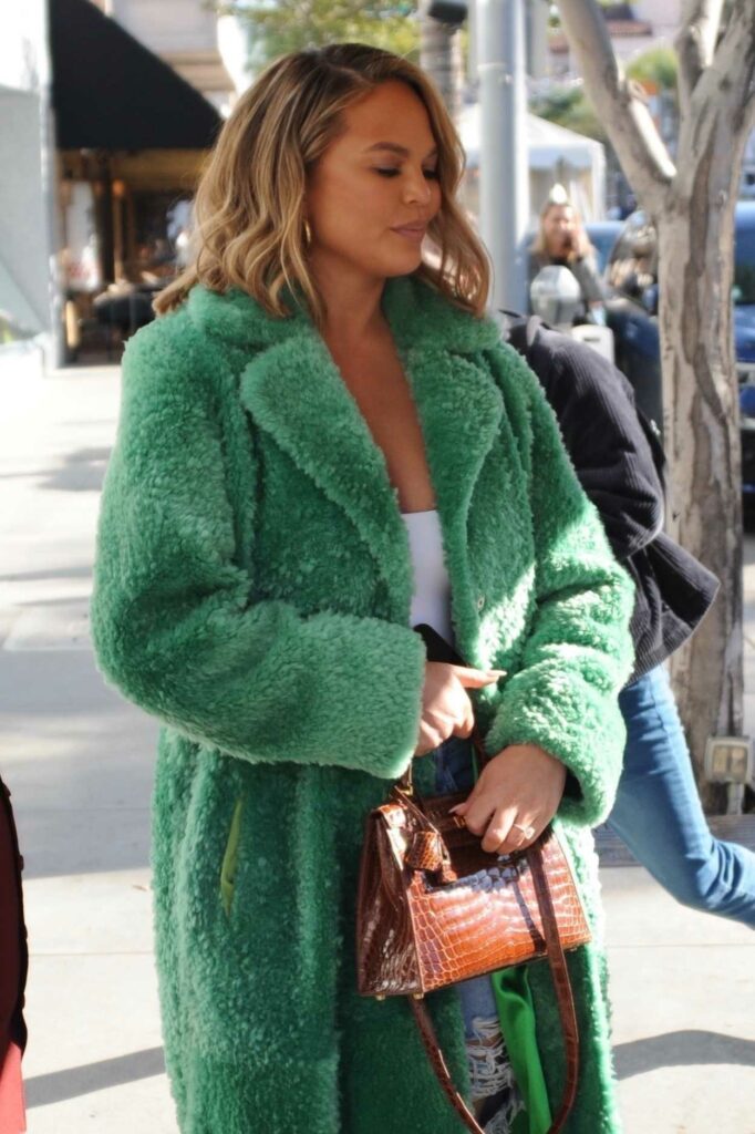 Chrissy Teigen in a Green Faux Fur Coat