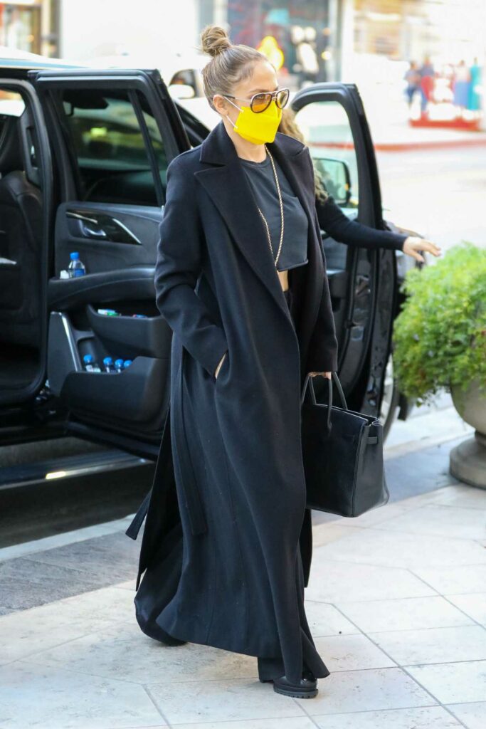 Jennifer Lopez in a Yellow Protective Mask