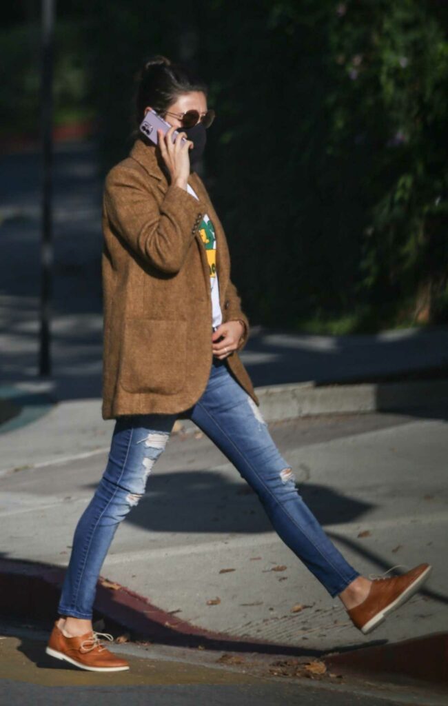 Mila Kunis in a Blue Ripped Jeans